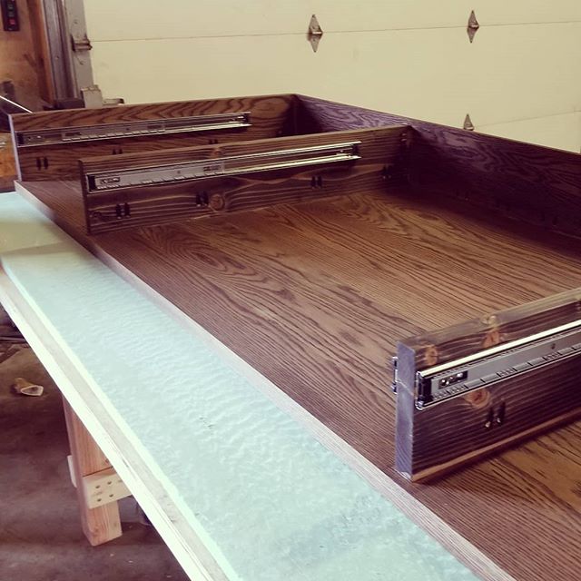 Installing drawer slides wasn't too bad.  A jig was made out of a 2x8 ripped to 3 3/4 to set the slides on for marking where the pilot holes go. #diy #doityourself #handyman #woodworking #wood #carpentry #maker #makersgonnamake